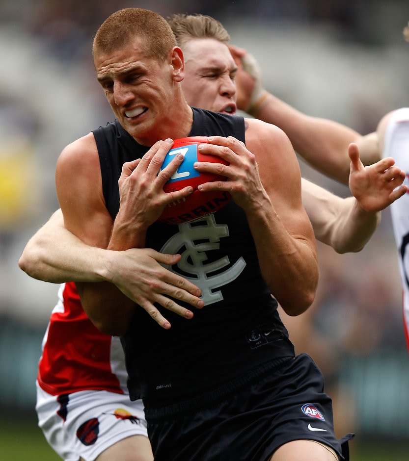 AFL 2016 Rd 22 - Carlton v Melbourne MELBOURNE, AUSTRALIA - AUGUST 21: Liam Jones of the Blues is tackled by Tom McDonald of the Demons during the 2016 AFL Round 22 match between the Carlton Blues and the Melbourne Demons at the Melbourne Cricket Ground on August 21, 2016 in Melbourne, Australia. (Photo by Michael Willson/AFL Media)